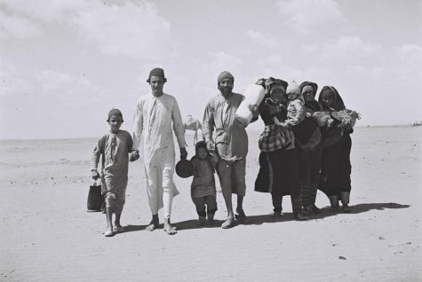 A Jewish-Yemenite family is walking through the dessert to a receiving camp set up by the Joint near Aden. 